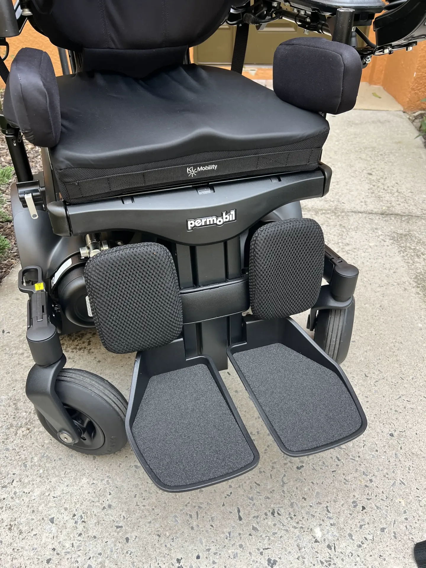 Close-up of Permobil M3 Corpus footplates and front of the seat