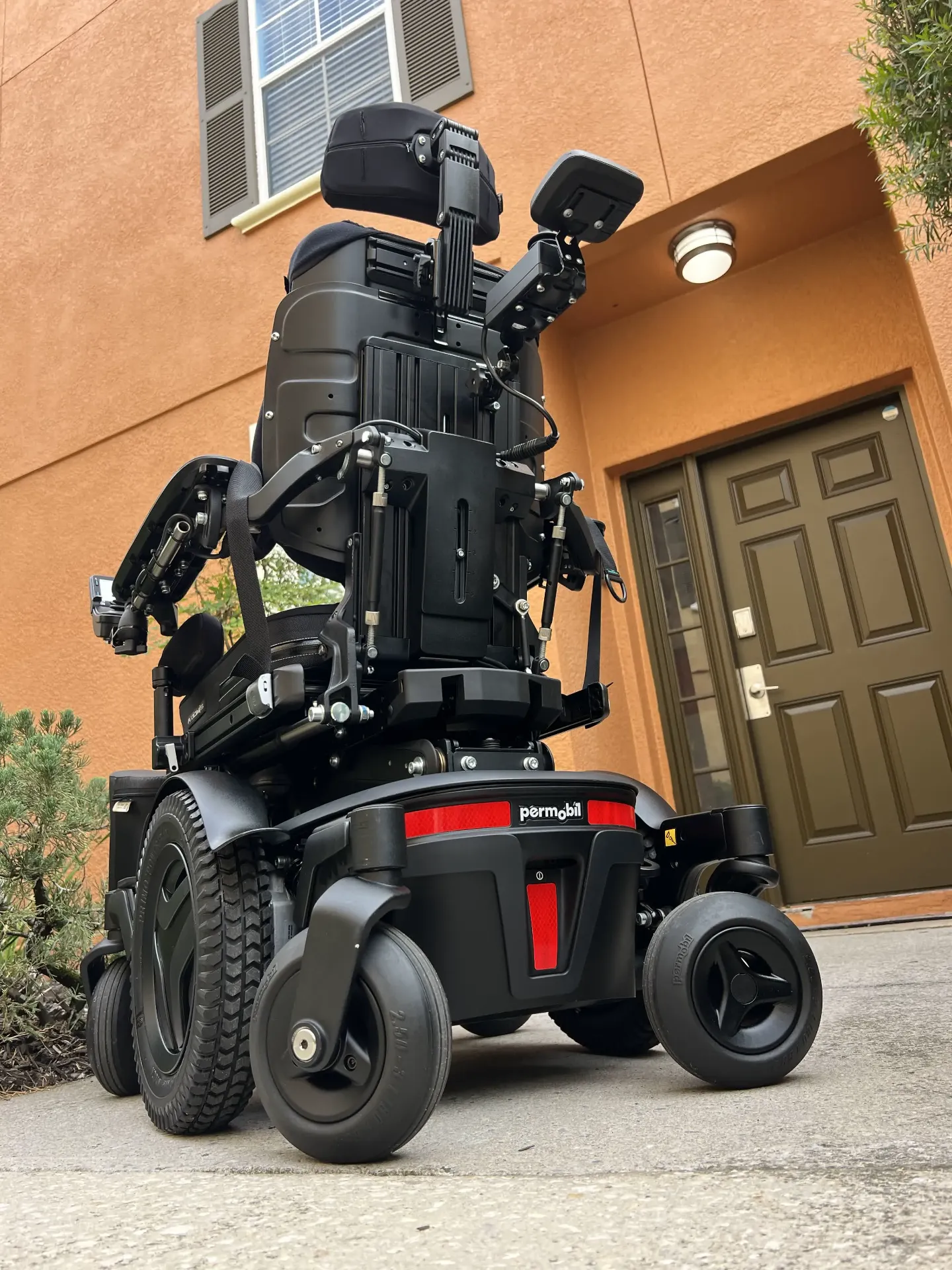 Permobil M3 Corpus power wheelchair rear view with red accents